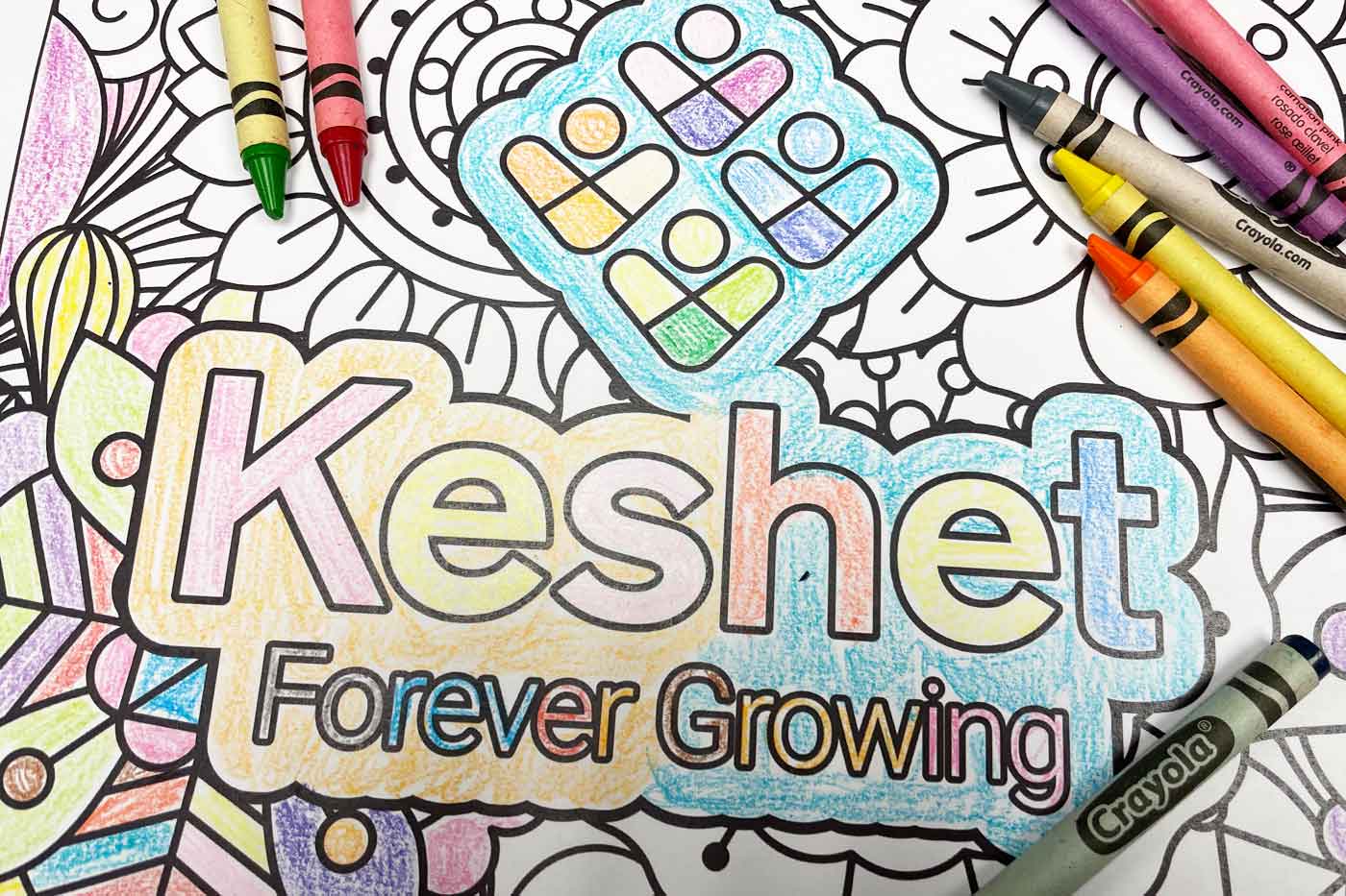 Partially colored Keshet Forever Growing coloring sheet with crayons.