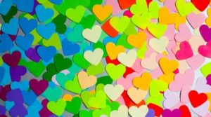 Many colorful cut-out hearts.