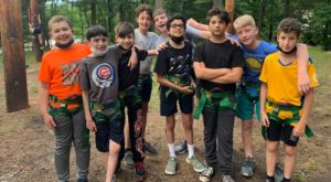 Group of pre-teen boys at Camp Chi ready to go on the ropes course.