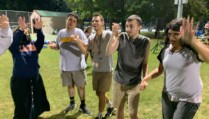Teens at dancing outside at Camp Chi