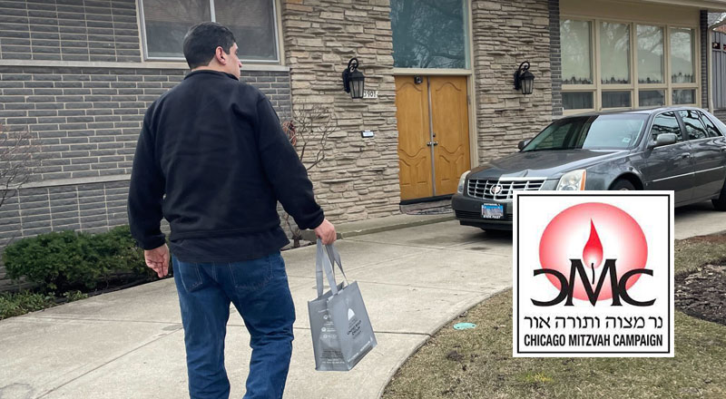 Adult volunteer delivering a bag of CMC meals to the front door of a house