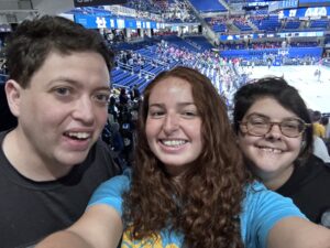 Selfie of Lindsey with two Keshet adults at the Chicago Sky basketball game