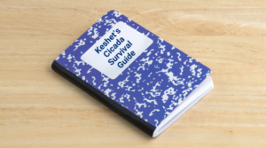 Blue composition notebook with text that says "keshets cicada survival guide"