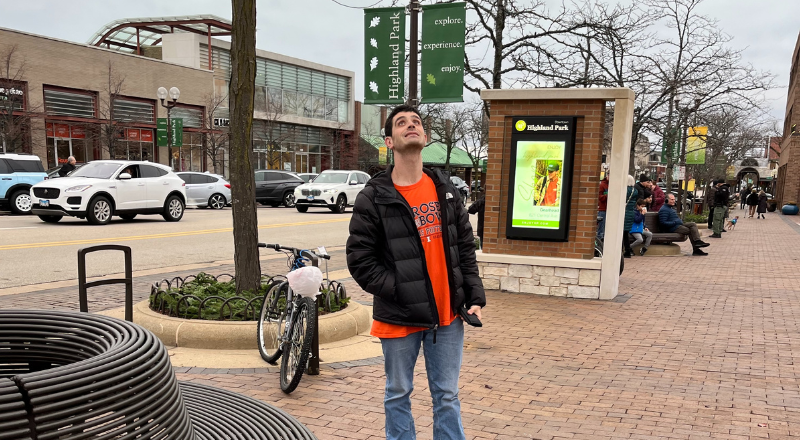 Team member standing in Downtown Highland Park