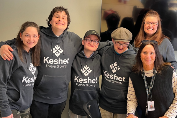 Group of Keshet staff and participants wearing matching gray Keshet sweatshirts