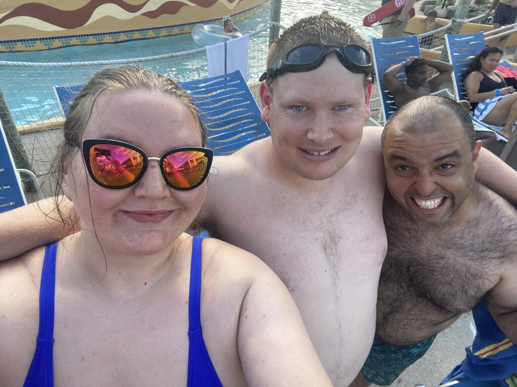 Selfie of Ashley with two team members at a waterpark