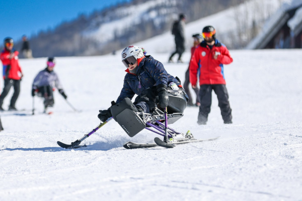 Person using adaptive skis on a mountain