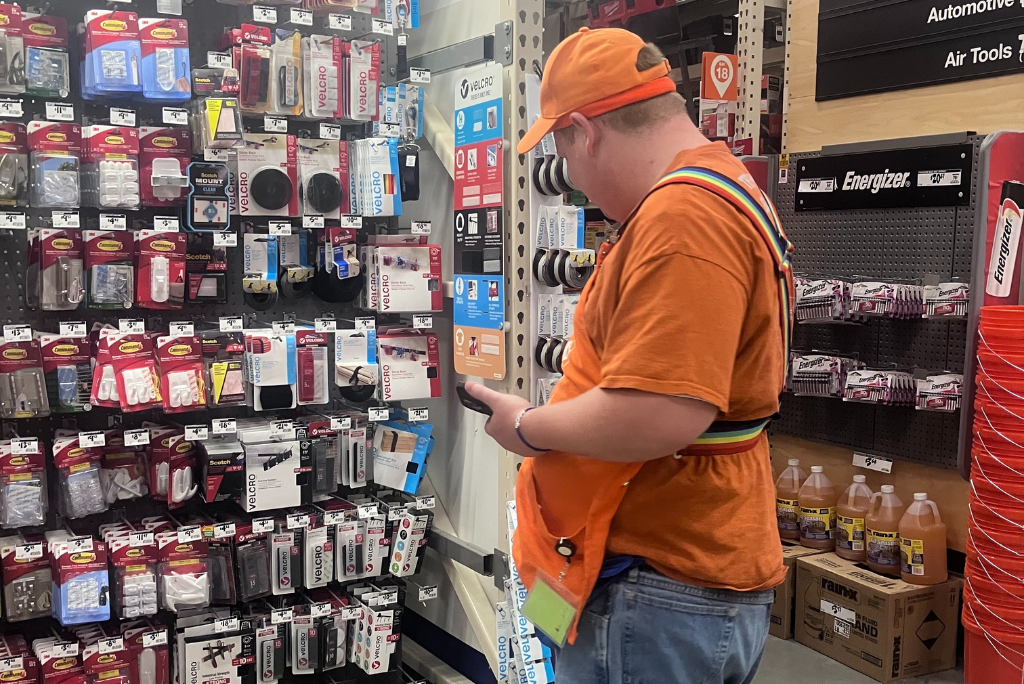 Team member taking inventory on the shelves at Home Depot