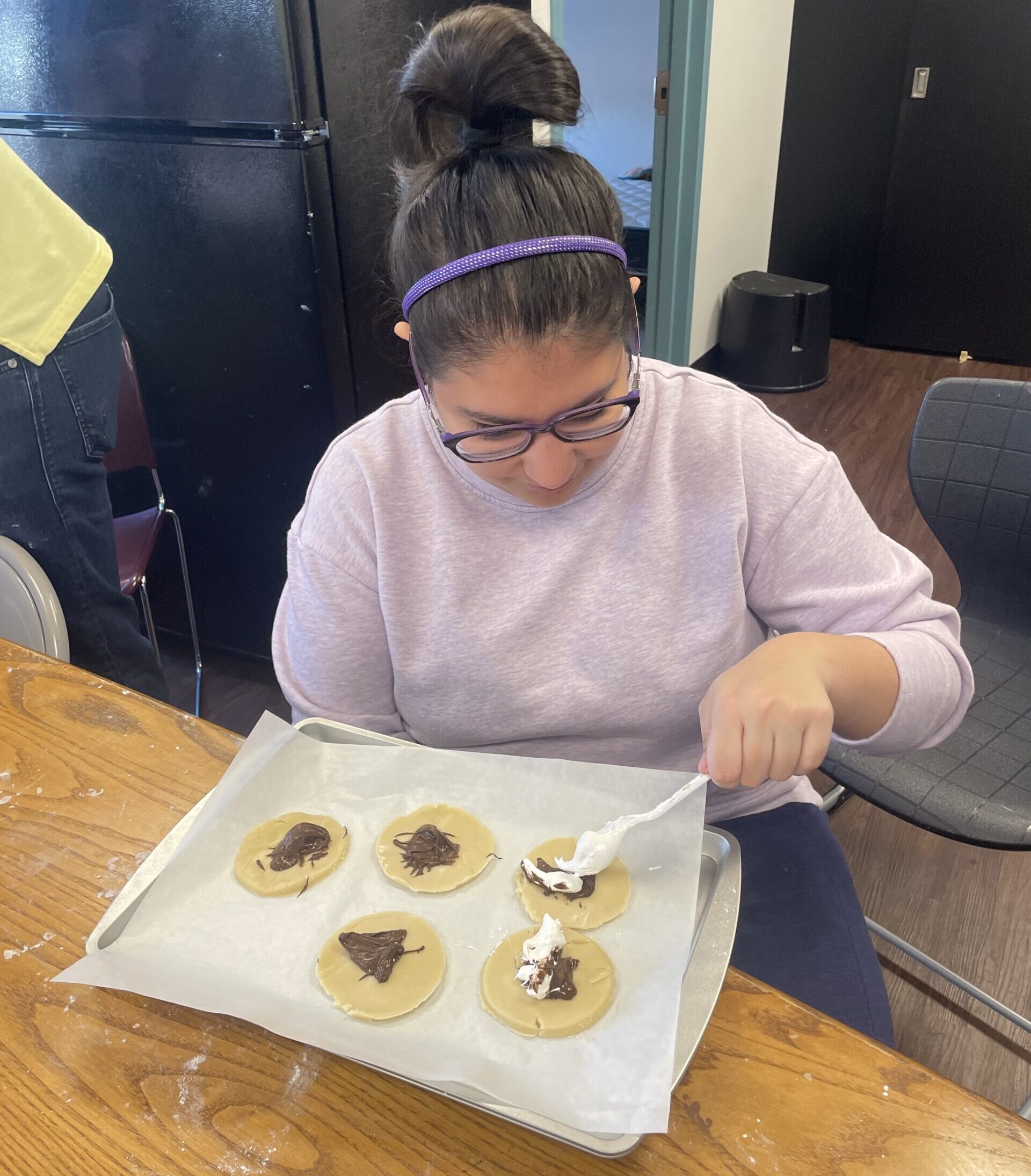 Transition student filling hamantaschen