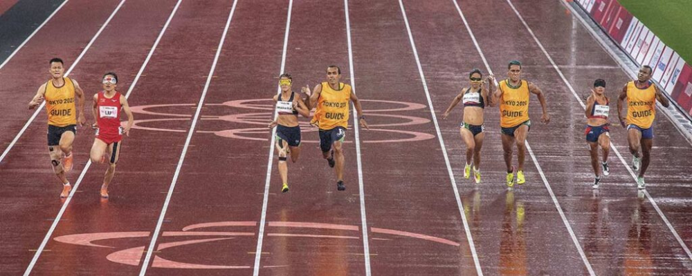 Paraolympic athletes running on a track at the olympics