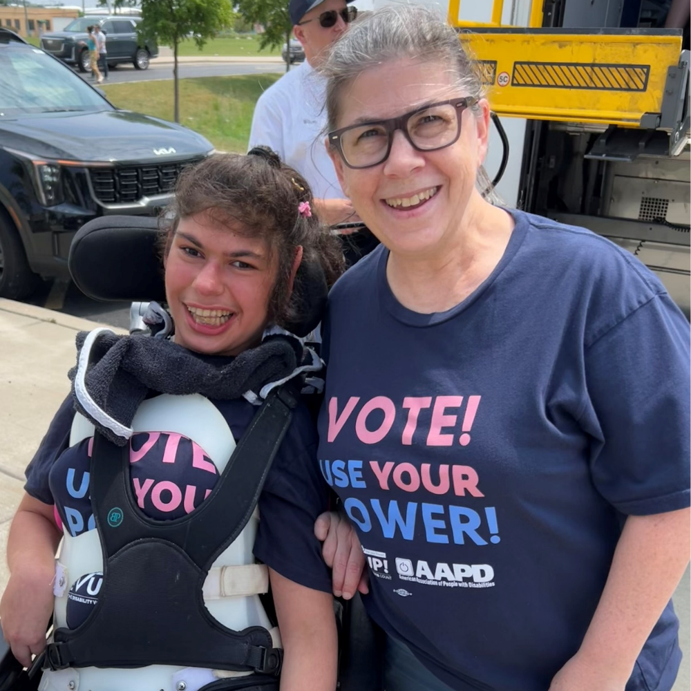 Carole and Hayden together in matching "vote! use your power! t-shirts"