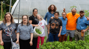 Group of adults standing together at the farm