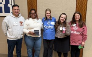 Jen with the four awardees. One is featured on a facetime phone and the other was not present.