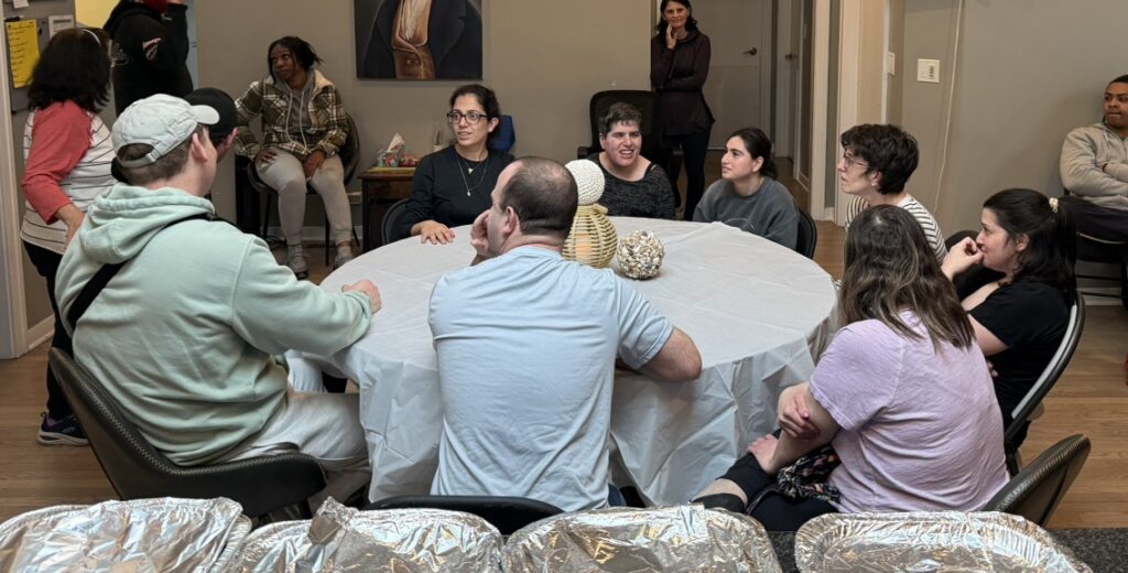 Group of residents sitting around a table for a Seder