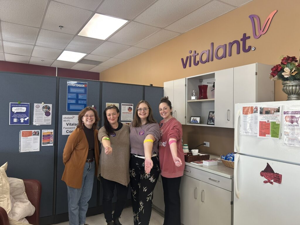 development team standing together with their blood donation