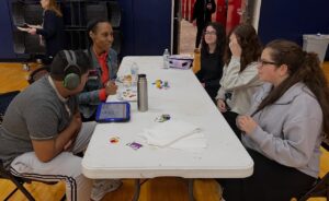 Keshet and ICJA students sitting around a table