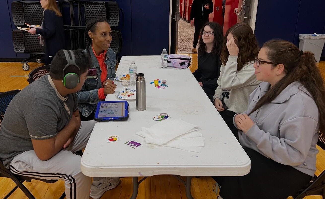 Keshet and ICJA students sitting around a table