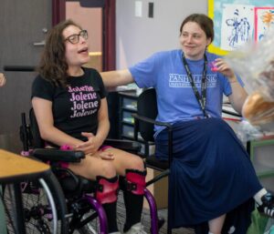 Megan smiling with one of her campers