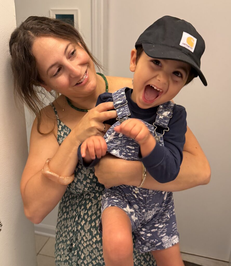 Rachel holding and hugging her son