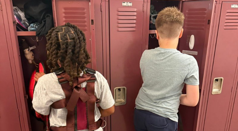 Students reaching into their lockers